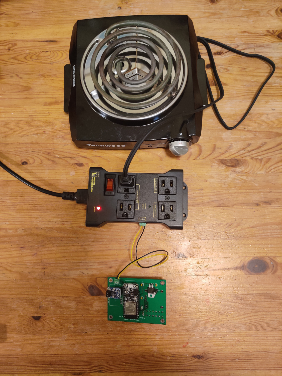 PCB connected to relay control, which looks like a power strip, control unit connected to hot plate via power cable